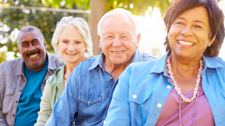 A group of older adults smiling.